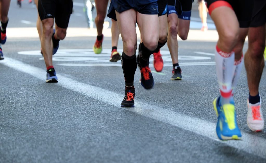- Aktivitus people running on gray asphalt road during daytime